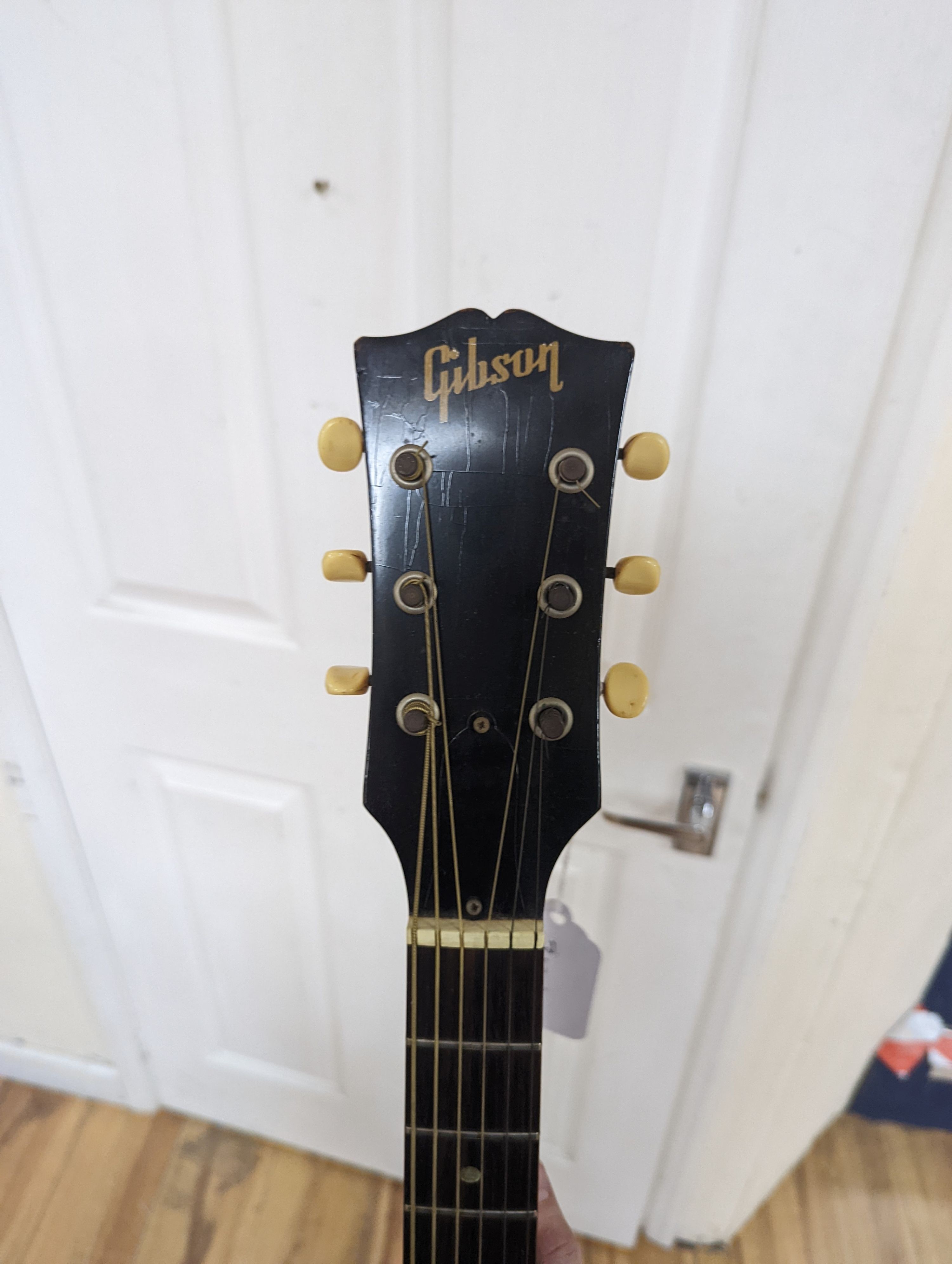 A Gibson acoustic guitar in hard case, serial no. 430 862